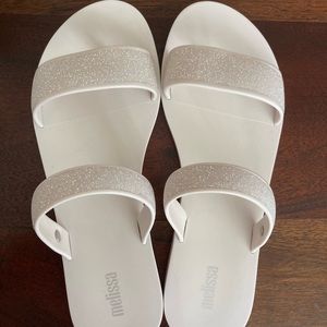 Brand new in box Sparkle Melissa sandals.  Size 7.  White.